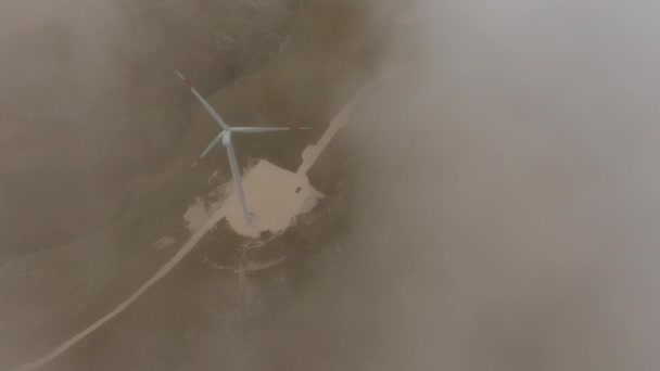 Aerial view behind clouds giant turbines electric generators — Stock Video