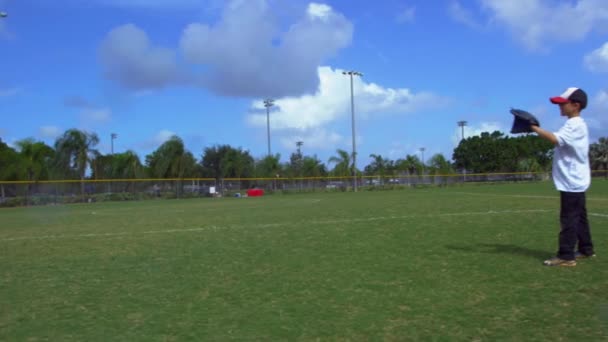 Slow Motion Pan Shot Kid Catching Ball Baseball Practice Park — Stock Video