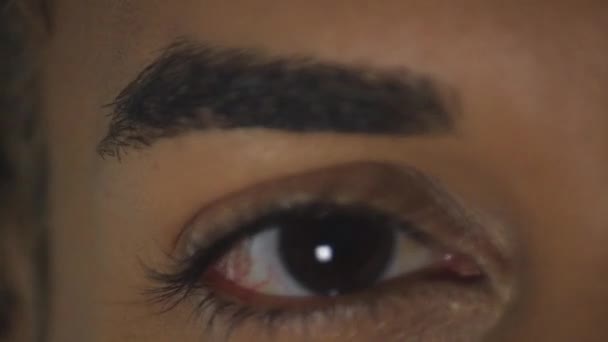 Close-up shot of a transgender womans eyes looking to camera — Stock Video