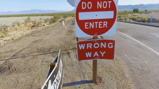Aerial shot from Do Not Enter signs to landscape between California & Nevada — Stock Video