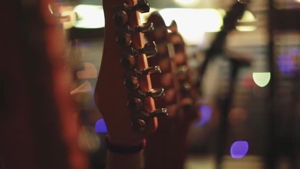 Electric and acoustic guitars on stage before a show — Stock Video