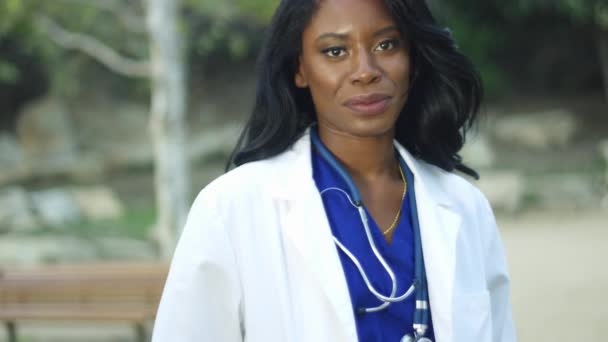 Slow Motion Beautiful Black Female Doctor White Coat Smiling Camera — Stock Video