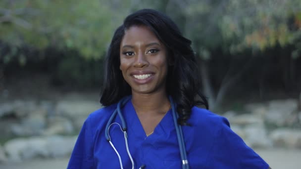 Slow Motion Beautiful African American Nurse Scrubs Smiling Camera — Stock Video