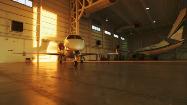 Indoor Shot Sunset Light Coming Two Private Jets Parking Aircraft — Vídeos de Stock