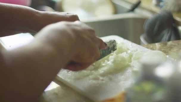 Slow motion of hands chopping onions — Stock Video
