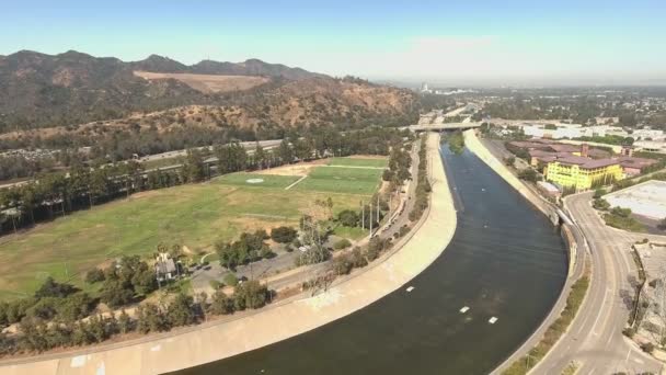 Aerial shot over soccer fields by mountains in Glendale, California — Stock Video