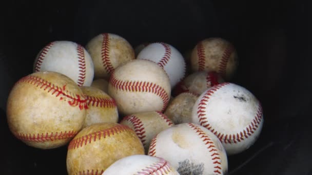 Macro shot through group of baseball balls — Stock Video