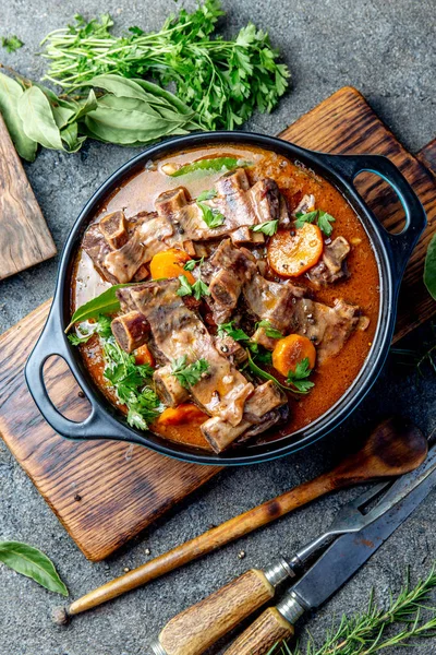 Beef ribs Bourguignon. Beef ribs stewed with carrot, onion in red wine. France dish. Top view