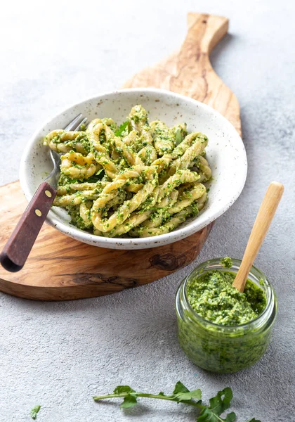 Pasta Lorighittas of Sardinia. Loriguittas with herb sauce pesto. in White plate. — Stock Photo, Image