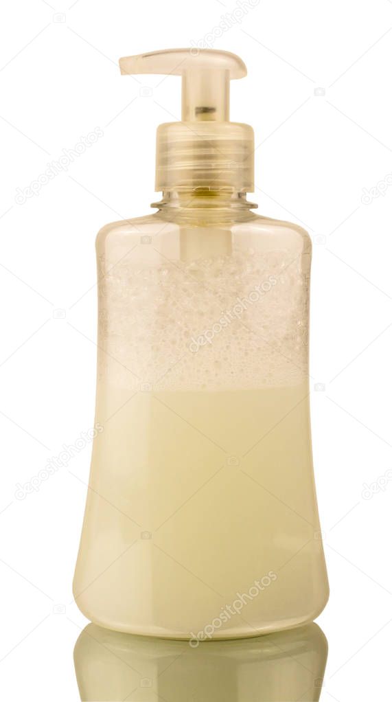 Plastic transparent bottle with dispenser with liquid soap inside and foam on a white background with a mirror image