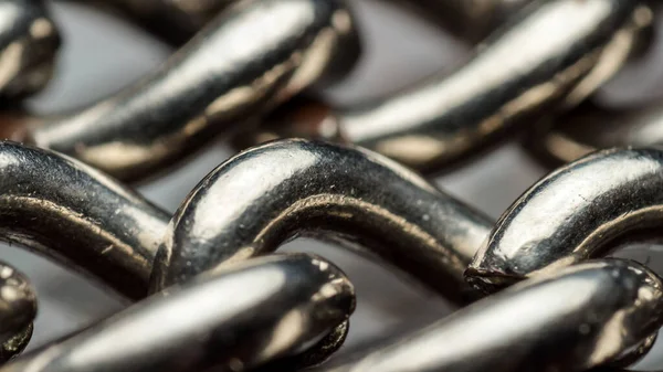 galvanized steel chain for wearing watches close-up, macro of togetherness of rings of one chain, concept of unity