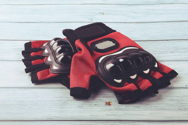 Motorcycle gloves isolated on wooden table