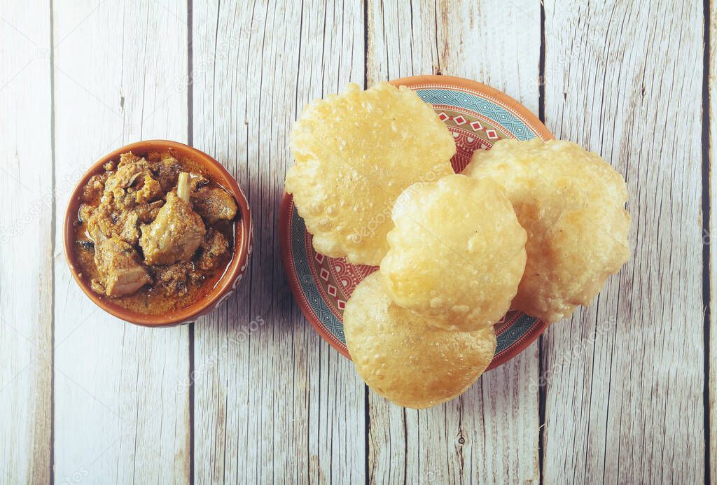 South Indian traditional food Poori or puri with country chicken curry