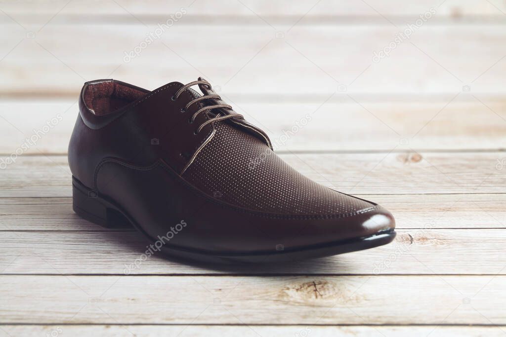 Men's formal leather Shoes isolated on wooden table