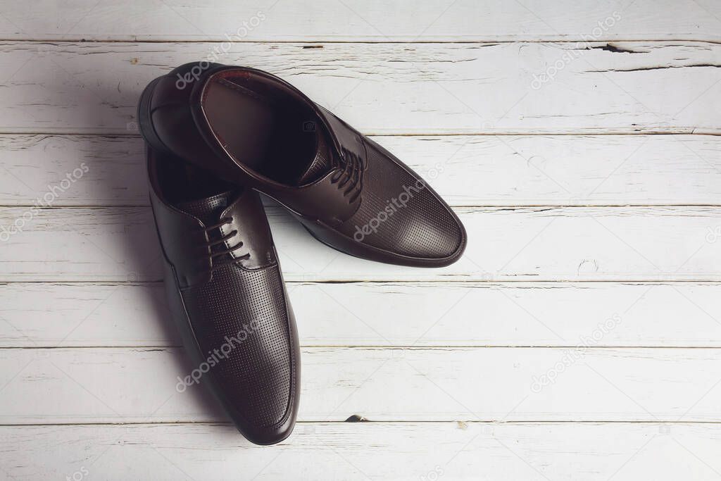 Men's formal leather Shoes isolated on wooden table