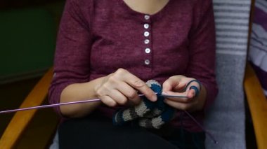 Close up hands of elderly woman knitting elderly woman knits