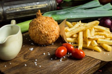 Chicken Kiev Cutlet. Boneless chicken breast with butter and herbs. Selective focus.	