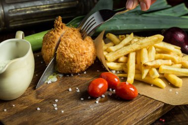 Chicken Kiev Cutlet. Boneless chicken breast with butter and herbs. Selective focus.	