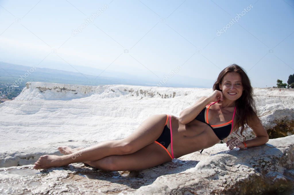 Gorgeous beauty. Dead sea salty shore. Sexy girl. Sexy woman with fit suntan body. Summer vacation in Pamukkale. Cotton castle in southwestern Turkey. Natural travertine pool terrace in Pamukkale.