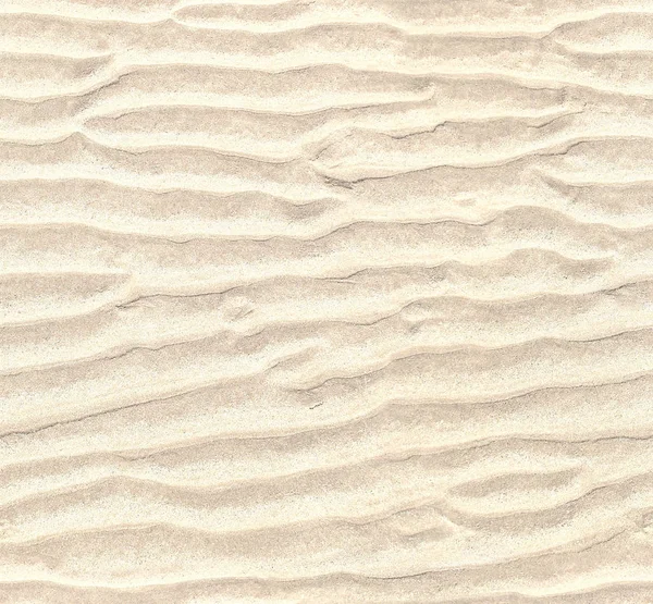 Seamless pattern of white sand. Repeating texture of waves on sandy beach background