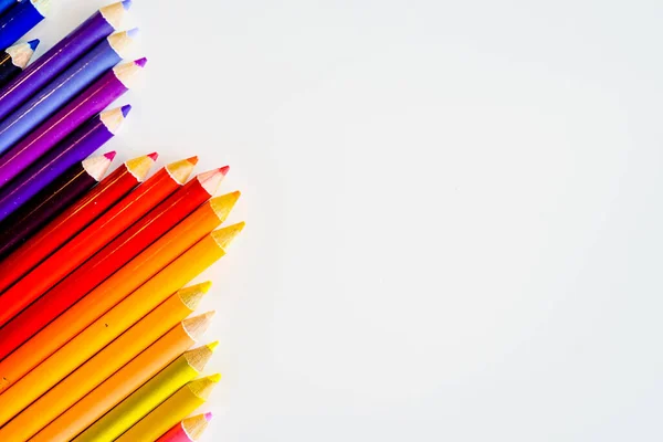 Line of color pencils isolated on white background. Close up. Copy Space. — Stock Photo, Image