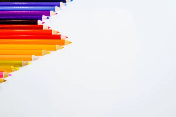 Line of color pencils isolated on white background. Close up. Copy Space. — Stock Photo, Image