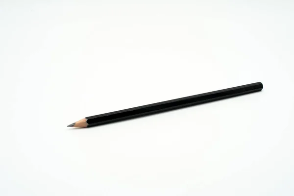 Чорний дерев'яний олівець ізольований на білому тлі — стокове фото