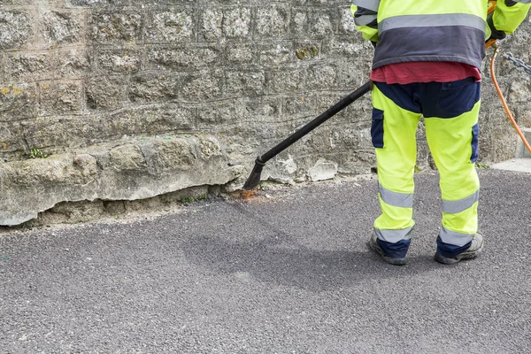 Man burn weeds with torch, thermal weeds control. Environmental protection