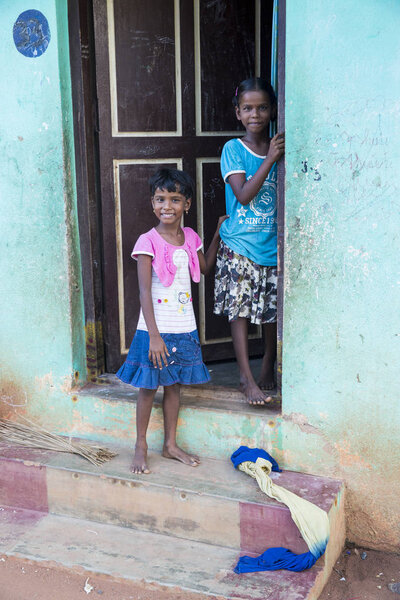 PONDICHERY, PUDUCHERRY, TAMIL NADU, INDIA - SEPTEMBER Circa, 2017. An unidentified poor girl in a small village, outdoor, looking at the camera