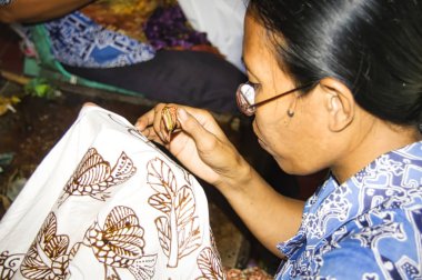 Woman indonesian painting Batik - Balinese traditional painting on fabric.