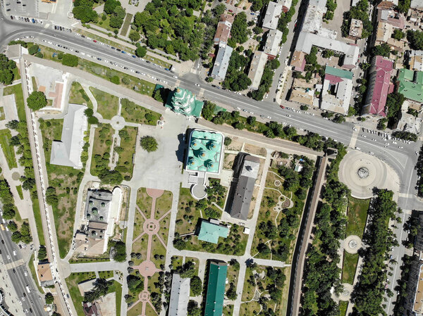 Astrakhan. Astrakhan Kremlin and Lenin Square top view. Fortress. Assumption Cathedral and the bell tower of the Astrakhan Kremlin. Flying drone over the Kremlin. Panorama of the city of Astrakhan. park for rest and walks. The central embankment of t
