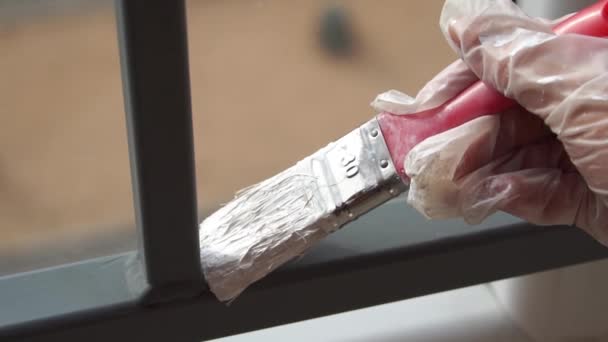 Girl Paints Balcony Railing White Paint — Stock Video