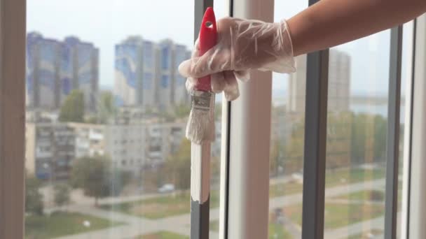 Girl Paints Balcony Railing White Paint — Stock Video