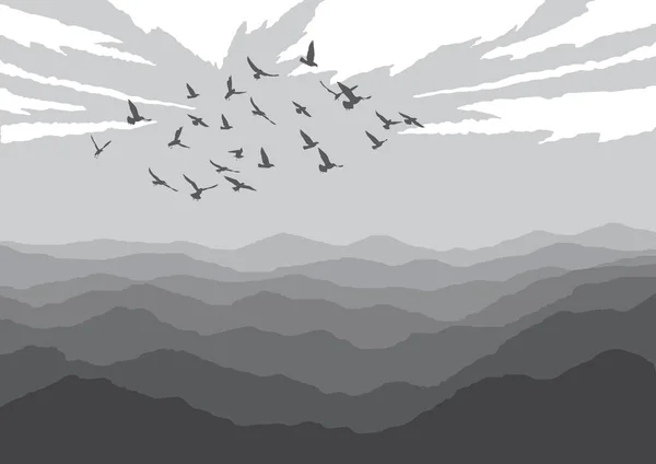 Landscape with silhouettes of birds over mountains