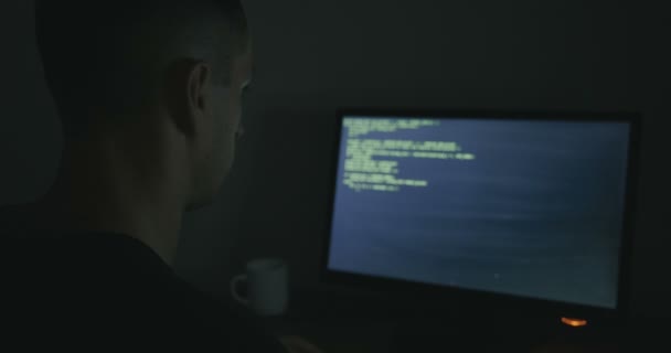 Hacker programmer is working on computer writing the code — Stock Video