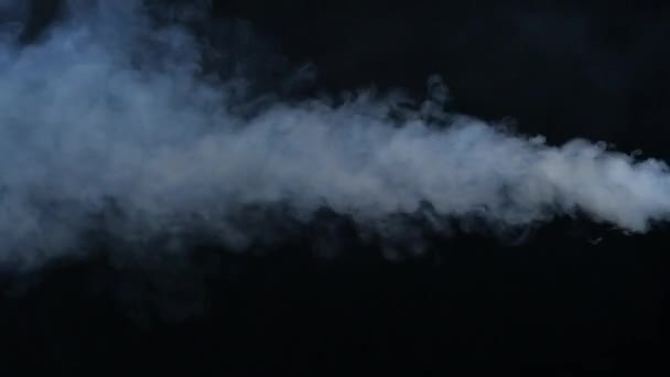 Stream of white smoke on an isolated black studio background. Smoke abstract. Smoke cloud. Smoke machine. Fog background. — Stock Video