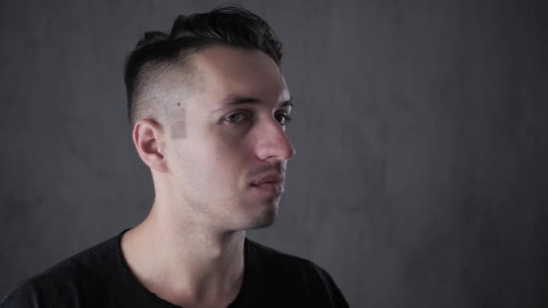 Closeup portrait of young stylish man at gray background — Stock Video