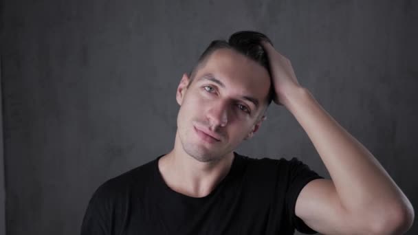 Closeup portrait of young stylish man at gray background — Stock Video