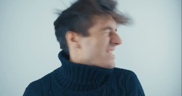 Portrait of Amazed Surprised Young Man in Black Sweater on white background. Sudden Victory or Success. Victory concept. Emotions of joy and delight — Stock Video