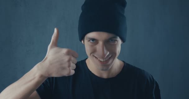 Portrait of Amazed Surprised Young Man in Black Shirt. Sudden Victory or Success. Victory concept. Thumb up — Stock videók