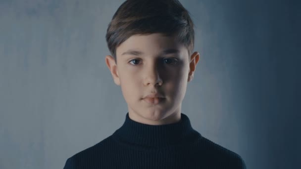 Close-up portrait of cute boy looking at camera — Stock Video