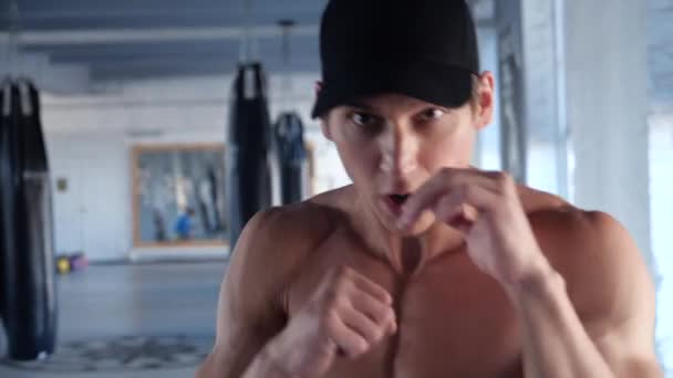 Close-up portrait of handsome man boxing at gym — Stock Video