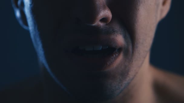 Close-up of a frightened man screaming with fear. Horror scene — Stock Video