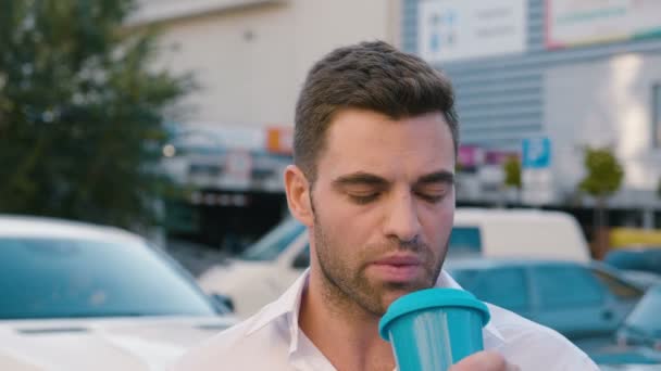 Portrait of Successful Businessman Drinking Delicious Coffee in city urban lifestyle. Handsome male employee looking at camera. — Stock Video