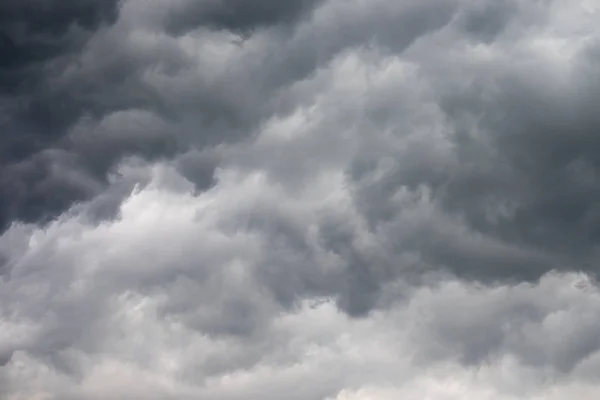 A group of black clouds are formed and gathered before the storm comes, or before it rains