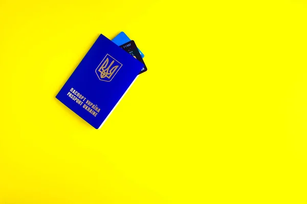 Ukrainian passport.international passport on yellow background. Money and documents for trip abroad. Documents for immigration