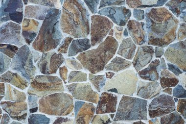 Taş bir duvarın dokusu. Eski kale taşından duvar dokusu. Bir taş duvarın parçası, arkaplan veya doku için