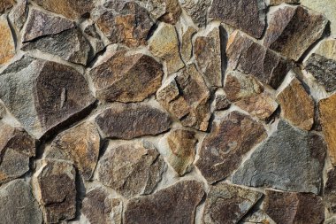 Taş bir duvarın dokusu. Eski kale taşından duvar dokusu. Bir taş duvarın parçası, arkaplan veya doku için