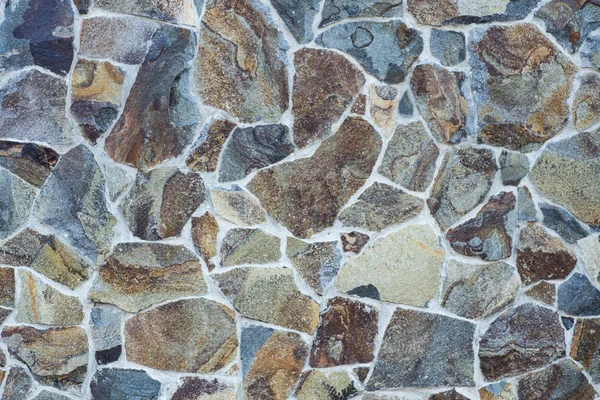 Taş bir duvarın dokusu. Eski kale taşından duvar dokusu. Bir taş duvarın parçası, arkaplan veya doku için