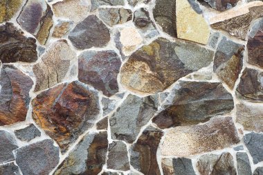 Taş bir duvarın dokusu. Eski kale taşından duvar dokusu. Bir taş duvarın parçası, arkaplan veya doku için